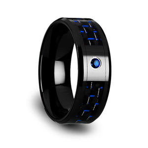 10 mm black ceramic ring with a black and blue carbon fiber inlay and a blue sapphire setting